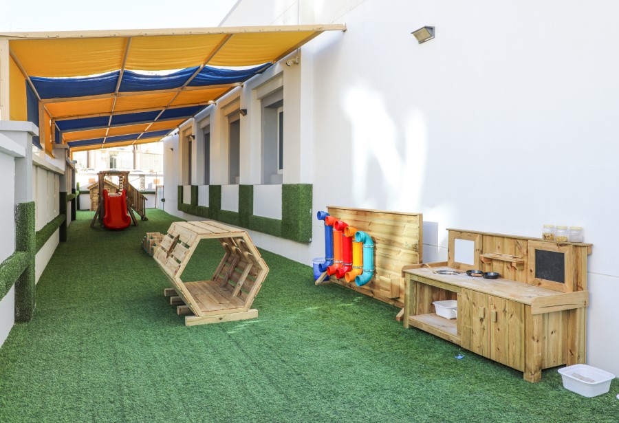 Outdoor terrace with messy-play and mud kitchen